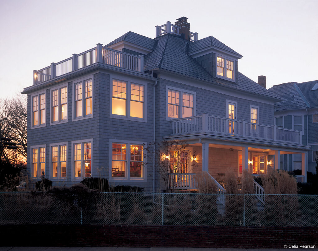 Double-hung windows seen from the exterior of a historic home with gray siding - St. Louis double-hung window installers - Kirkwood Home Gallery